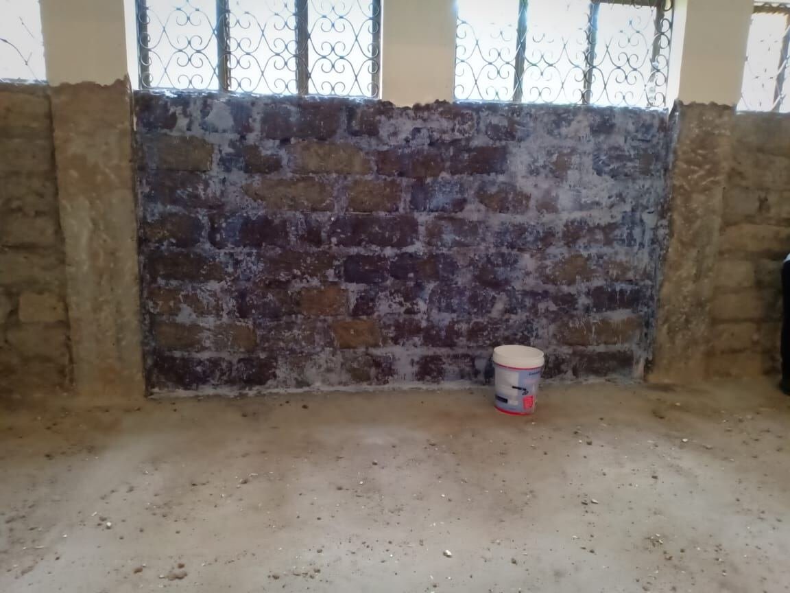 Bare basement wall before waterproofing