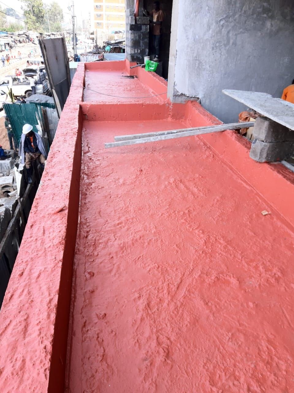 Applying parapet waterproof coating, Nairobi CBD
