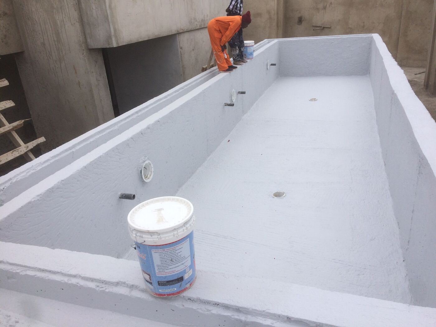 Applying swimming pool waterproof coating