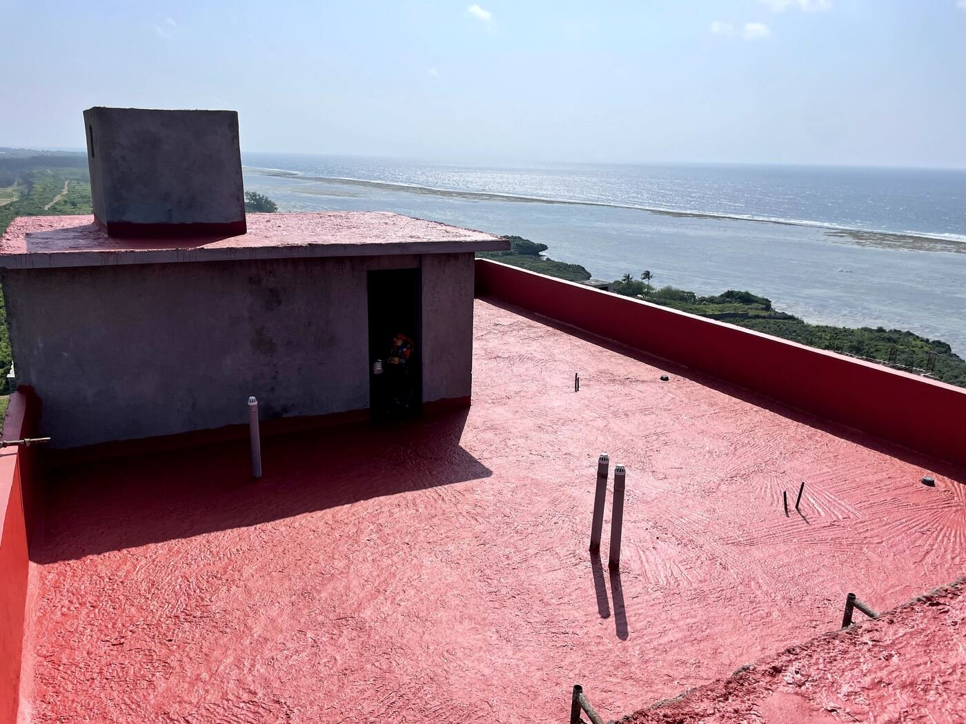 Rooftop slab waterproofing, utility shaft detail — coastal site
